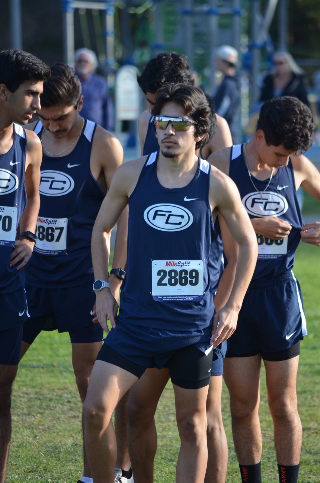 John on the start line racing for his college cross country team